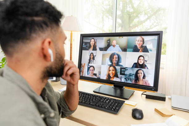 istock Unrecognizable businessman wearing earbuds teleconferences with diverse co-workers 2169088393