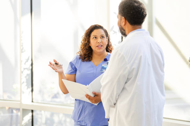 istock Head nurse asks unrecognizable male doctor questions 2169089171