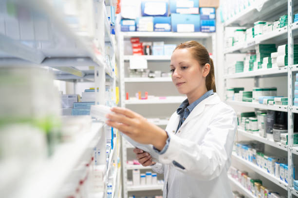 istock Pharmacist searching for medicine in storage room 2169090141