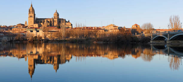 Salamanca skyline featuring the cathedral and its reflection on the Tormes river (Spain).