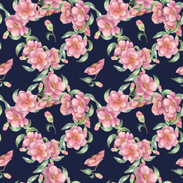 istock A seamless pattern of pink camellia flowers with green leaves on a deep navy background. Floral watercolor clipart ideal for fashion design 2169091767