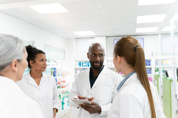 istock Pharmacy staff team meeting 2169096320