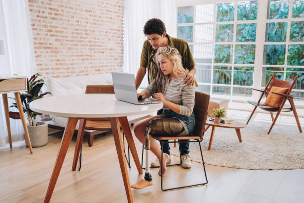 istock Couple using laptop at home 2169102258