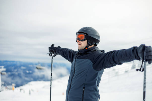 istock Person posing with ski poles on a snowy mountain. 2169103360
