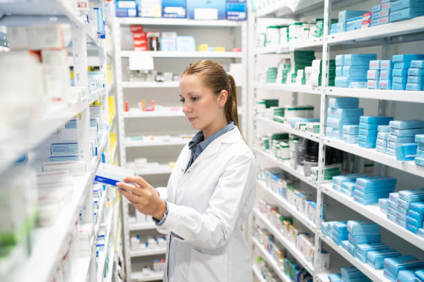 istock Pharmacist searching for medicine in storage room 2169104586