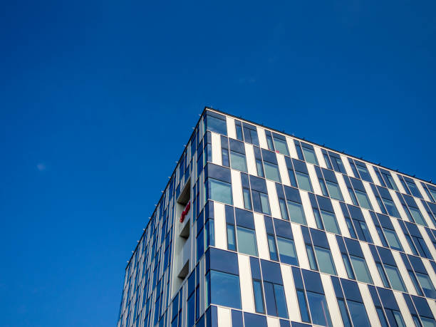 istock Modern Blue Office Building with Numerous Windows 2169106518