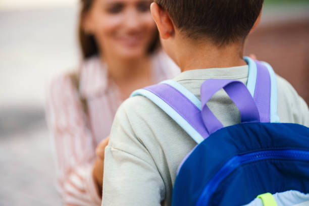 istock Back to School: Mom Sending Son to Elementary School 2169109352