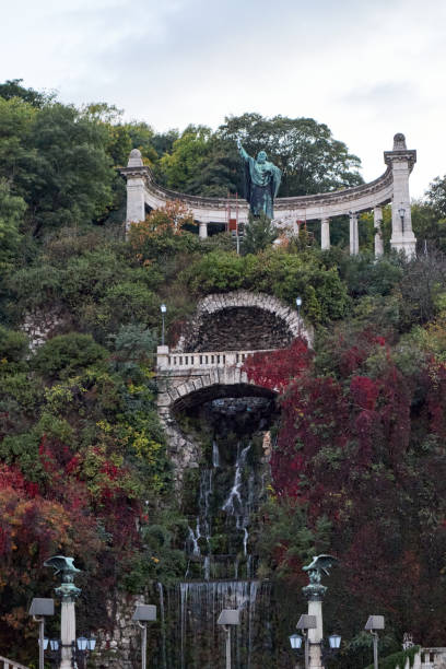istock grand monument built into a hillside, with a cascading waterfall 2169112274