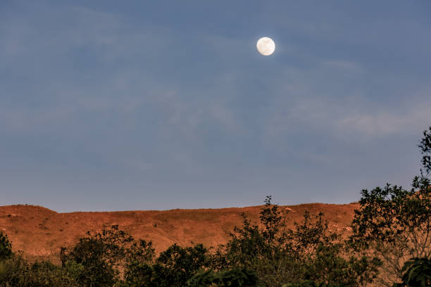 istock The almost  full crescent moon rises over the Iguaque mountain 2169112422