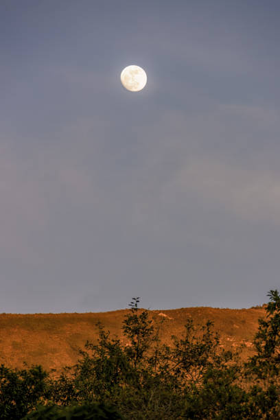 istock The almost  full crescent moon rises over the Iguaque mountain 2169112989