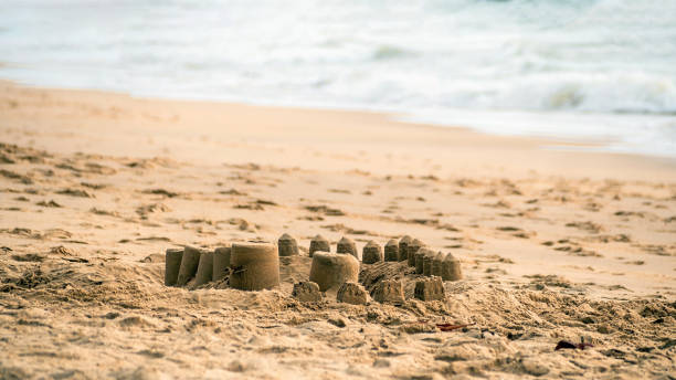 istock The small sand castles on the sandy beach 2169116494