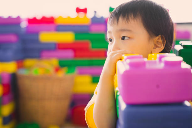istock Asian boy playing with puzzles in the playground. 2169120387