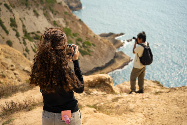 istock Photographers taking a photo on a cliff 2169122335
