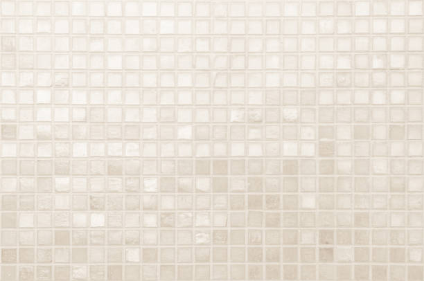 istock Cream light ceramic wall and floor tiles mosaic background in bathroom and kitchen. Design pattern geometric with grid wallpaper texture decoration pool. Simple seamless abstract surface clean. 2169129529