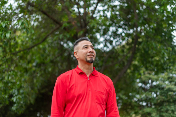 man smiling relaxed in the park