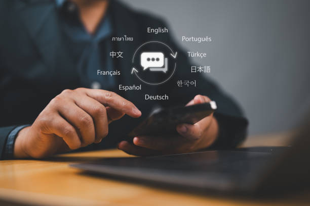 istock Translator app, language course and e-learning concept. Person use smartphone with Translator app, translation or translate on the mobile app worldwide language conversation speaking concept. 2169141500
