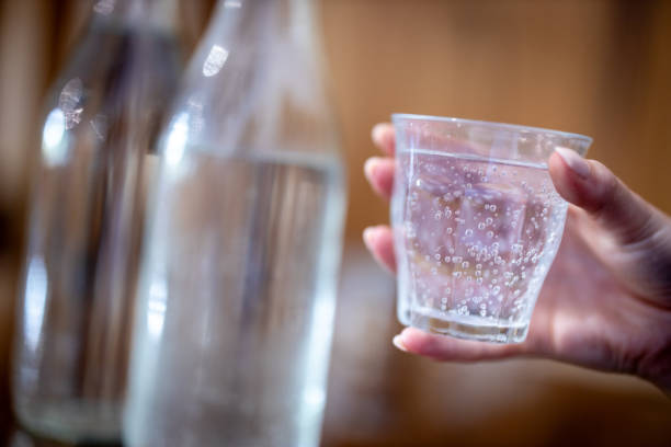 istock Still or sparkling water in a glass cup at a cafe. 2169142293