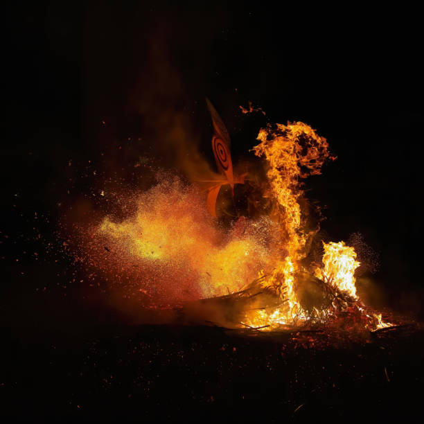 he captivating photo depicts the Baining Fire Dance performed at night. In this sacred ceremony, Baining dancers move in a state of trance, barefoot through the flames, connecting with ancestral spirits represented by the masks they wear. The dance is a powerful reminder of their close relationship with these spirits.