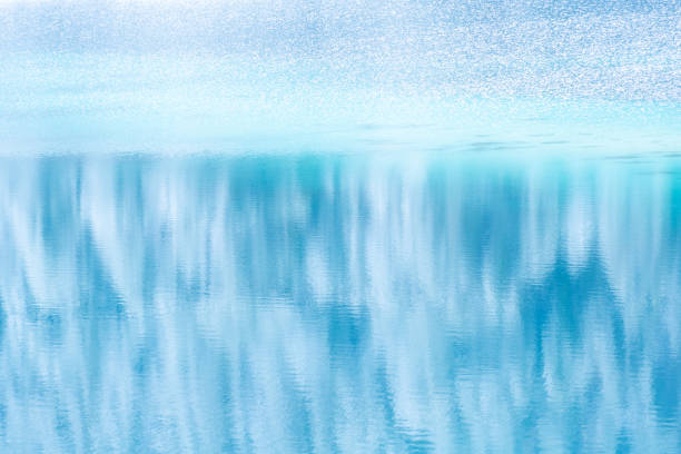Beautiful shining pebbles under clear turquoise water