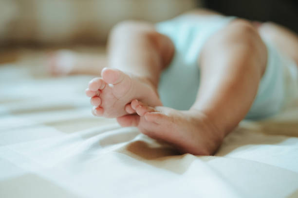 istock Baby foot when sleeping on bed selective focus 2169162743