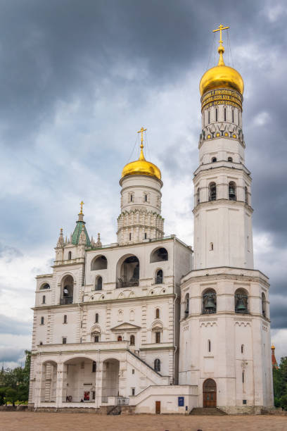 istock Ivan the Great Bell Tower, with Assumption Belfry on the right in Moscow Kremlin. Blue sky background with sunbeams 2169165934