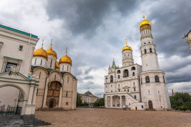 istock Ivan the Great Bell Tower, with Assumption Belfry on the right in Moscow Kremlin. Blue sky background with sunbeams 2169165984