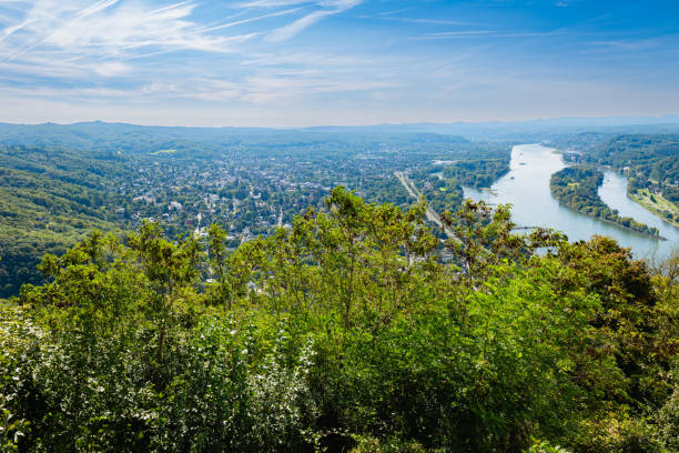 A breathtaking view from Drachenfels summit, overlooking the Rhine River and the surrounding Siebengebirge hills, showcasing the natural beauty of Königswinter.