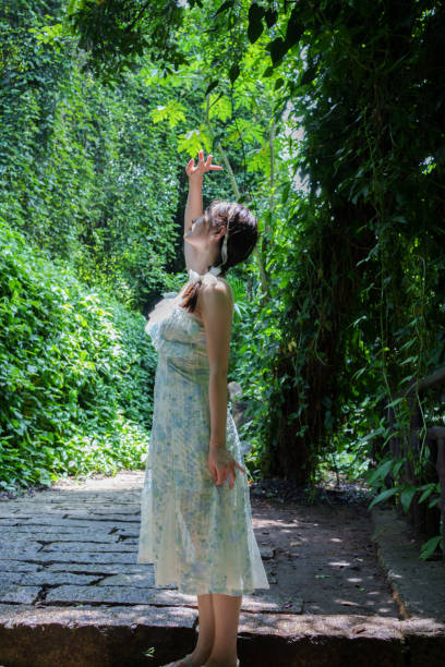 Young female tourist in forest park