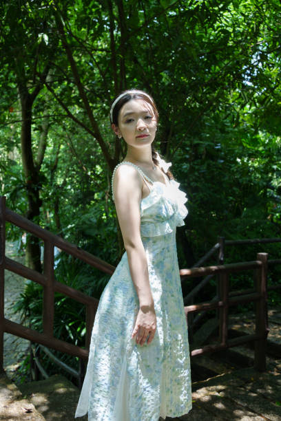 istock Asian woman in forest park 2169166835