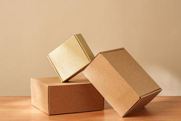 istock Some Cardboard Boxes on a Wooden Table 2169177316