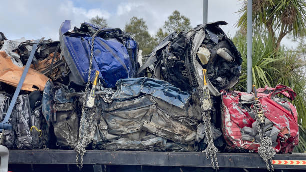 istock Piled of unrecognisable, wrecked cars being transported 2169179013
