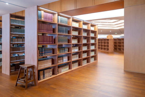 istock Neat rows of bookshelves in the library 2169179747