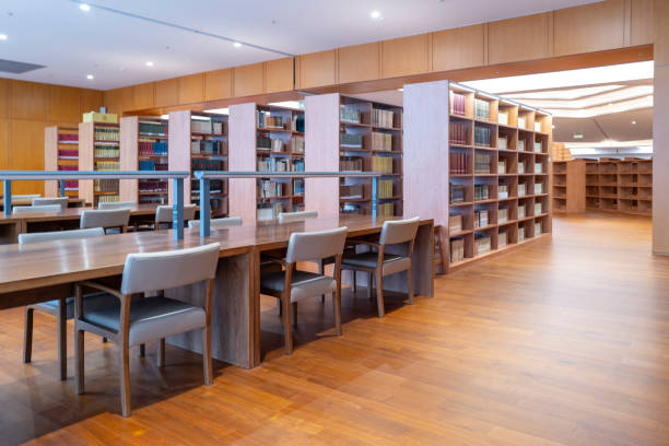 istock Neat rows of bookshelves in the library 2169179779