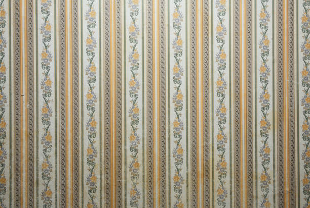istock Old wallpaper on the wall. Old wallpaper for texture or background. 2169180379