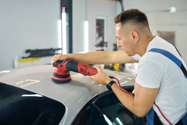 istock Man uses a modern polishing machine in the detailing process 2169180619