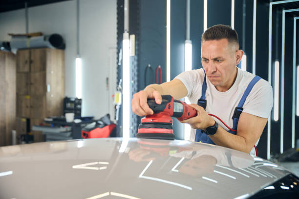 istock Man polishes a shiny car roof 2169180627