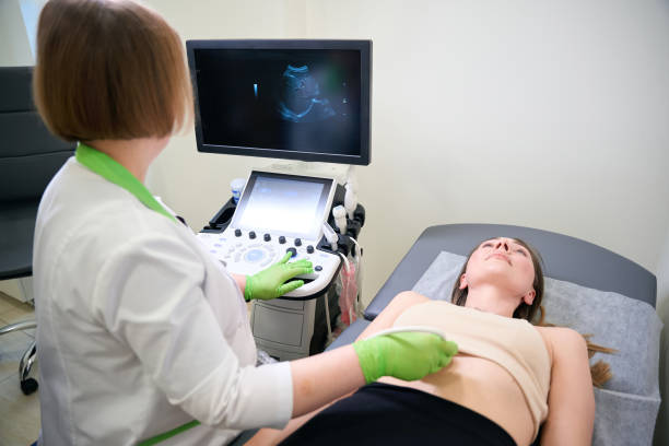 istock Doctor performing abdominal ultrasound scan on patient 2169184707