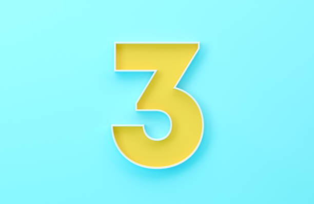 Yellow Number Three Sitting On Blue Background. Finance and Numbers Concept.