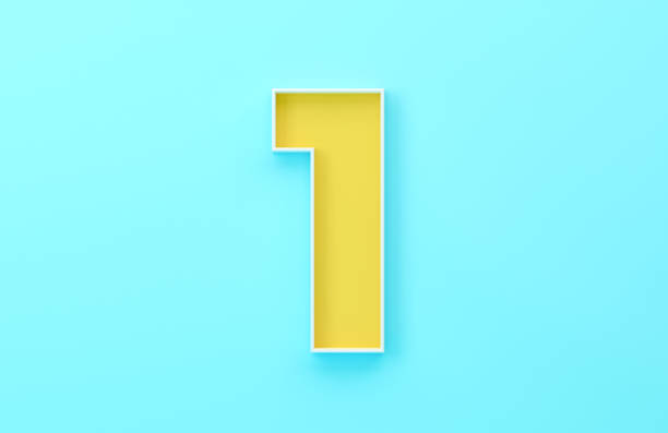 Yellow Number One Sitting On Blue Background. Finance and Numbers Concept.
