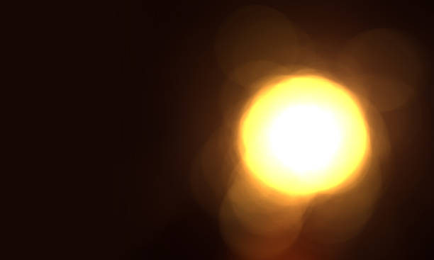 abstract black background with yellow light and bokeh.