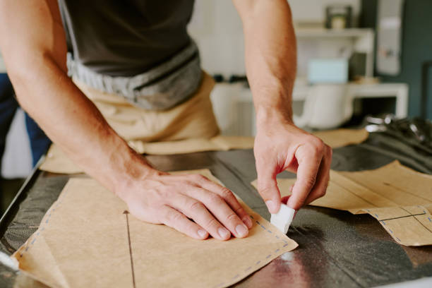 istock Male Hands Drawing Out Stencil 2169192360