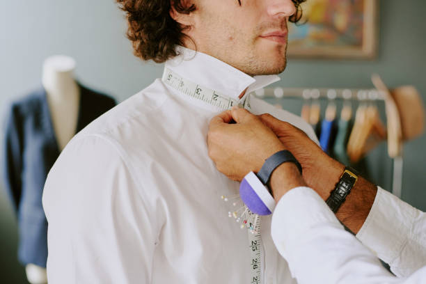 istock Tailors Hands Taking Measurements of Collar 2169192663