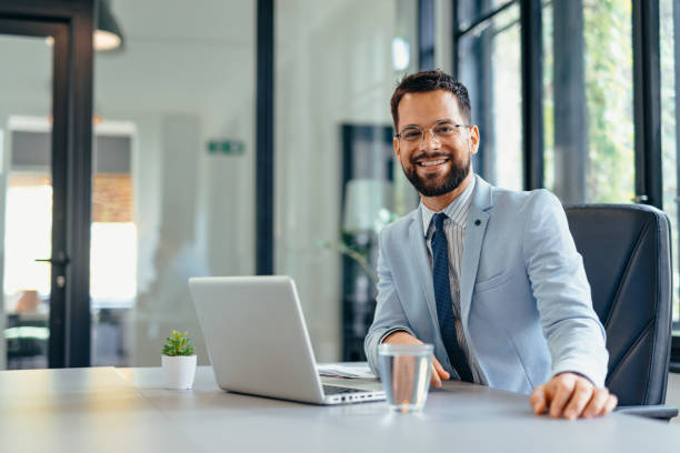 istock Happy businessman working on laptop in the office 2169193085