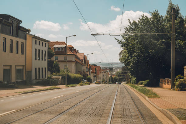 Tram tracks in Germany on a road\nPhoto taken in a smaller city