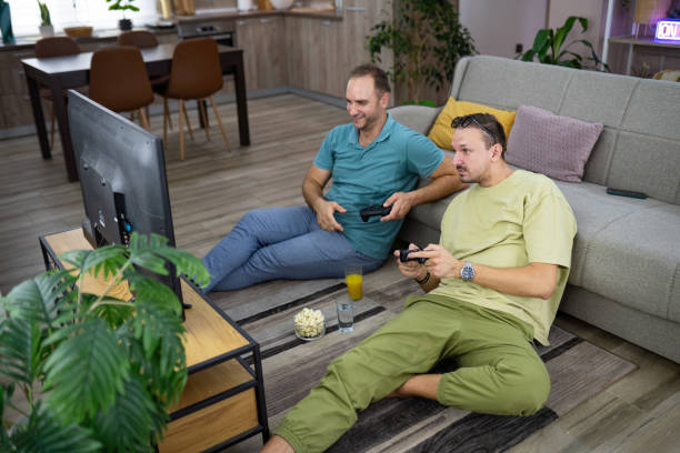 istock Two male friends having fun 2169195437