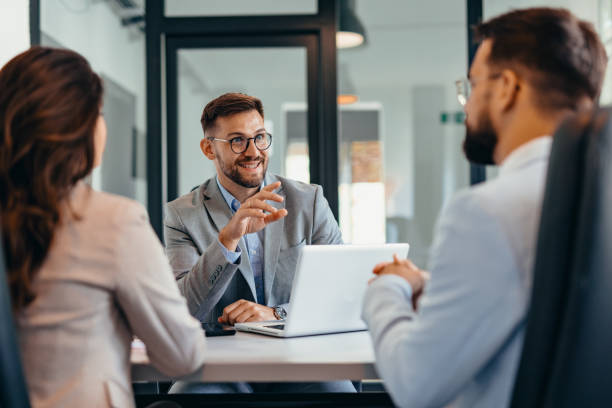 istock Group of business persons talking in the office 2169197292