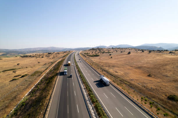 istock Trucks on a rural highway 2169198041