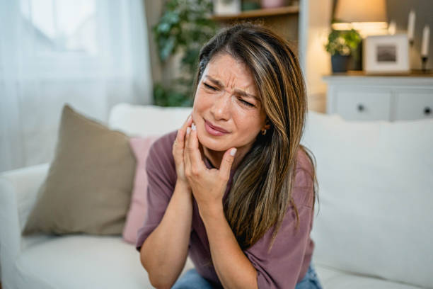 istock Young woman suffering from toothache 2169198560