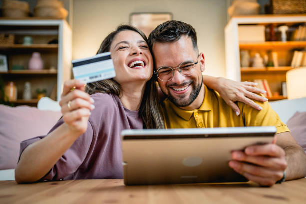 istock Young couple using tablet for online shopping 2169198639