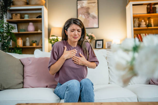 istock Young woman suffering from chest pain 2169198750